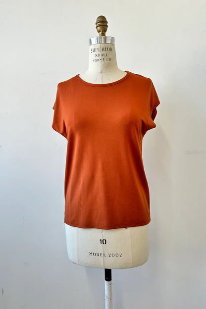 The Eowyn T-Shirt by Kollontai in Rust is shown on a white mannequin against a white background 