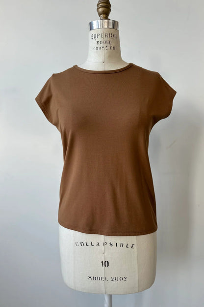 The Eowyn T-Shirt by Kollontai in Caramel is shown on a white mannequin against a white background.