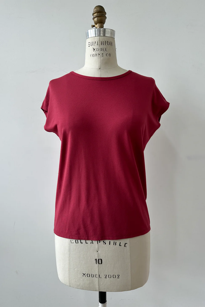 The Eowyn T-Shirt by Kollontai in Raspberry is shown on a white mannequin against a white background 