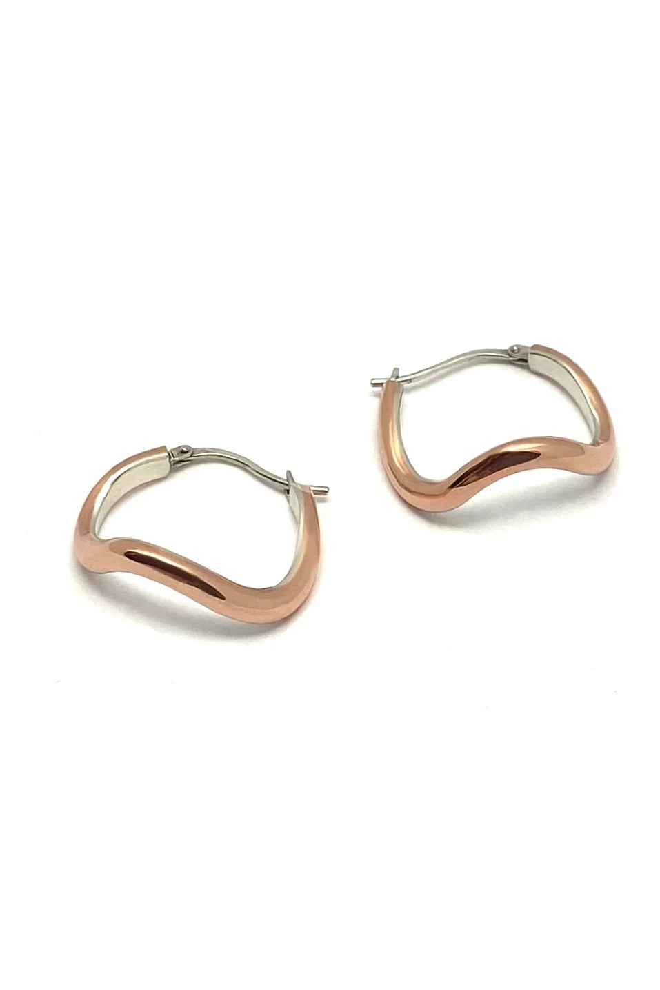 Copper silver lined hoop earrings on a white background