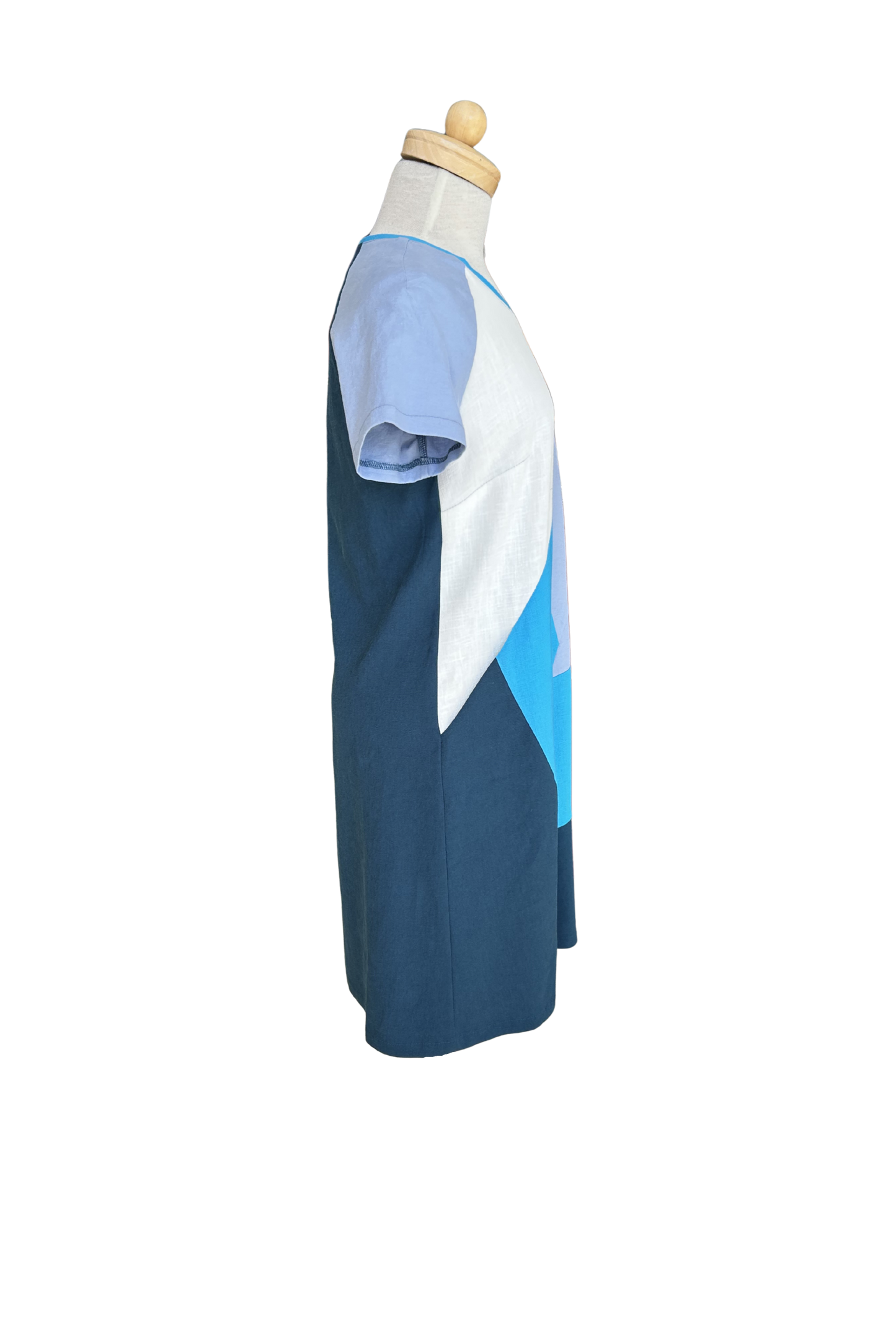 A side view of the Victoria Dress by Solomia is shown on a mannequin against a white background. 