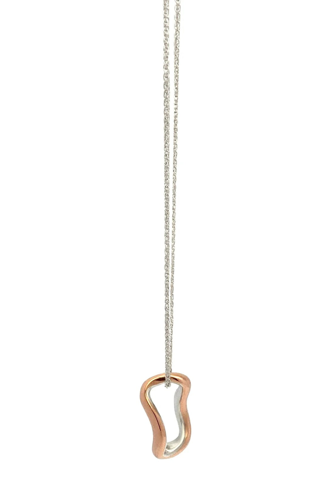 Copper and silver necklace with a unique pendant on a white background