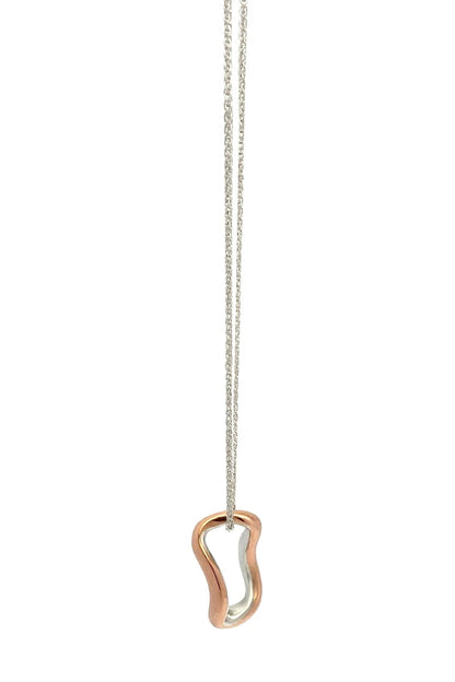 Copper and silver necklace with a unique pendant on a white background