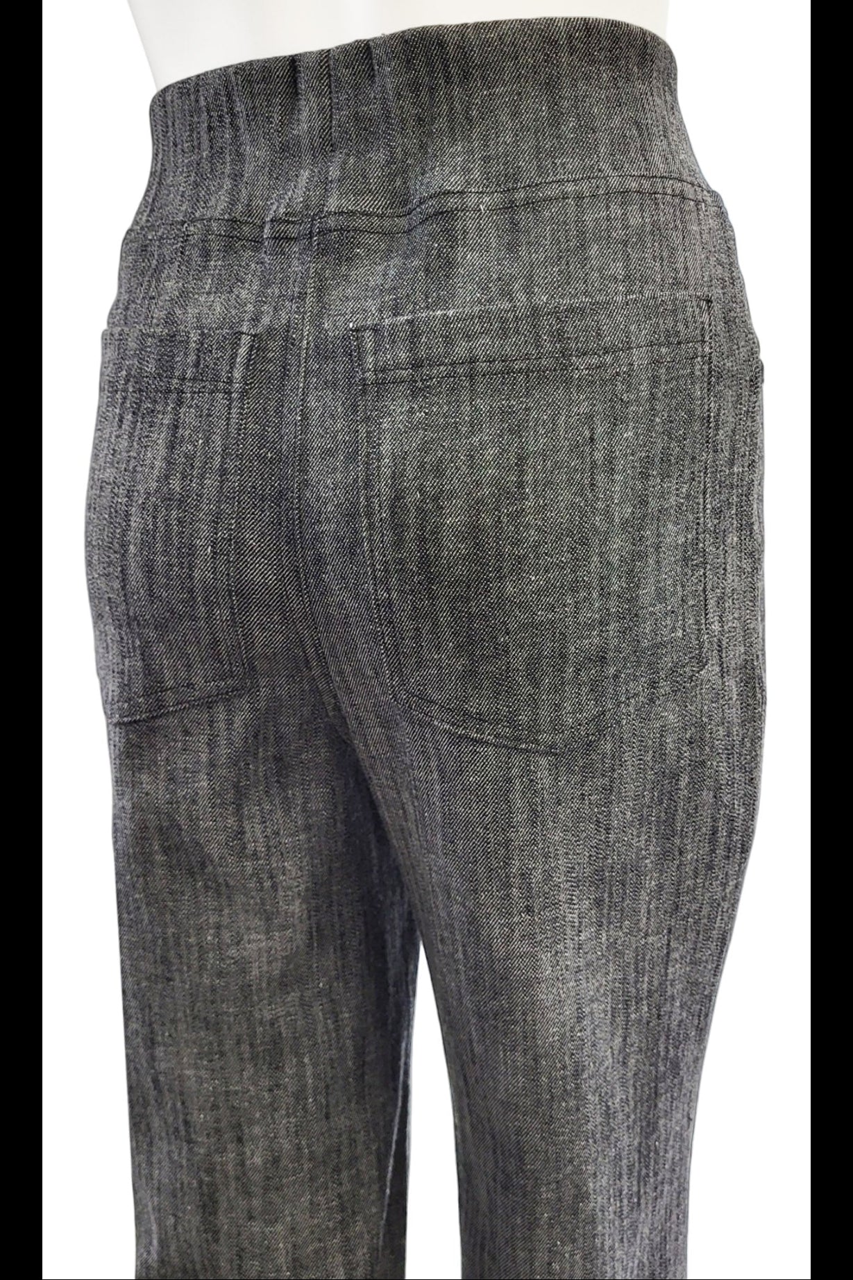 Close up back view of the Wade Vintage Denim Pants in Graphite by Mandala are shown on a mannequin against a white background.