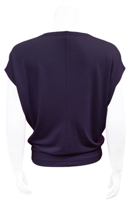 A back view of the Mandala Charlie Slouch Tee in Night Sky Navy is shown on a mannequin against a white background. 