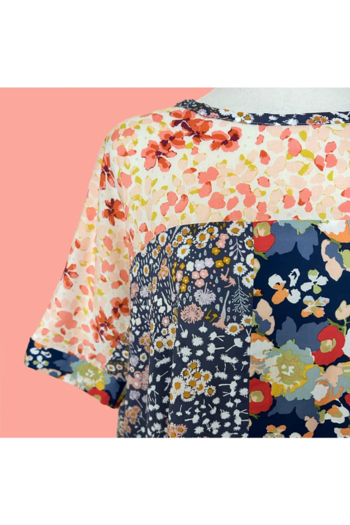 The Chloe Top by Desserts and Skirts in Floral Strip is shown on a pink and white background