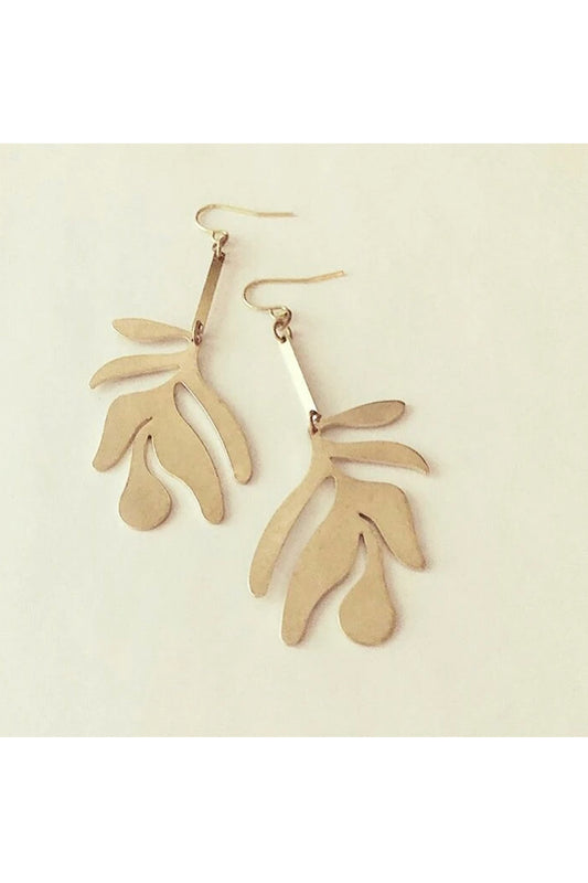 Fullie dangle earrings by Darlings of Denmark; smooth raw brass; abstract leaf hanging off slim brass bars; flat lay